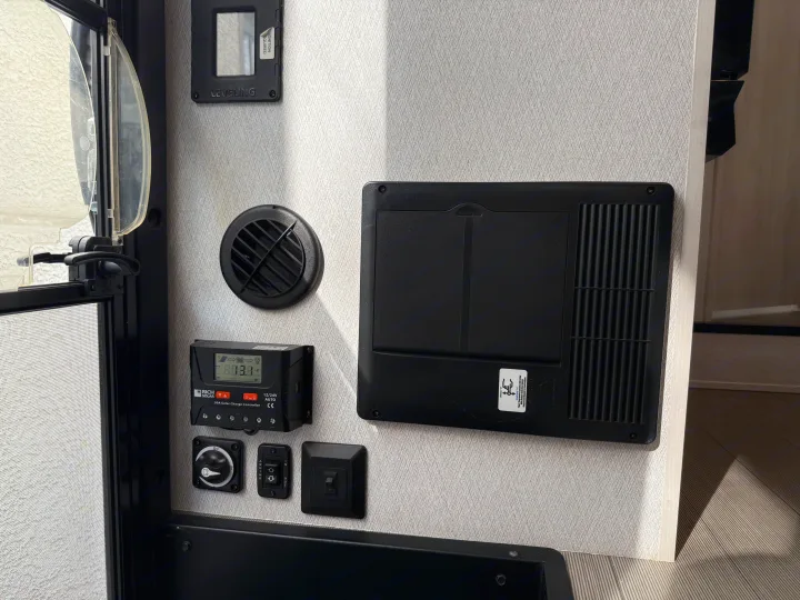 RV rental interior shows solar charger, battery disconnect, awning controls, and leveling system.. Forest River ENTRADA 3100FB 2024