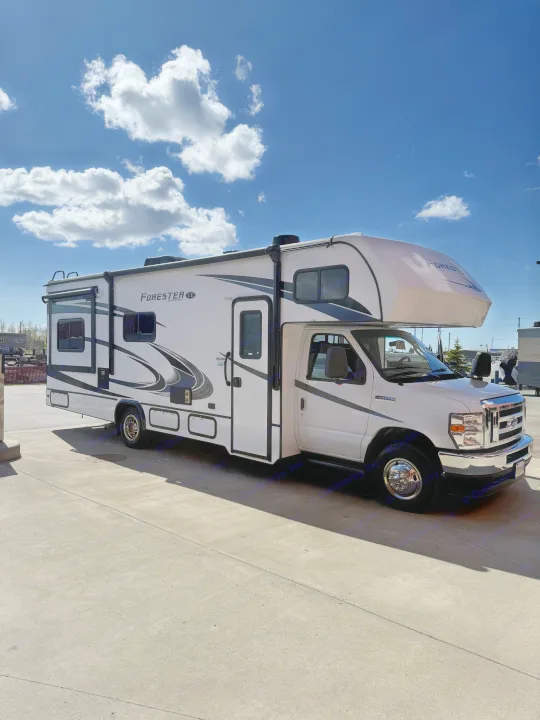 White Forester Class C RV rental parked on a sunny day, ready for new adventures.. Forester LE 2022