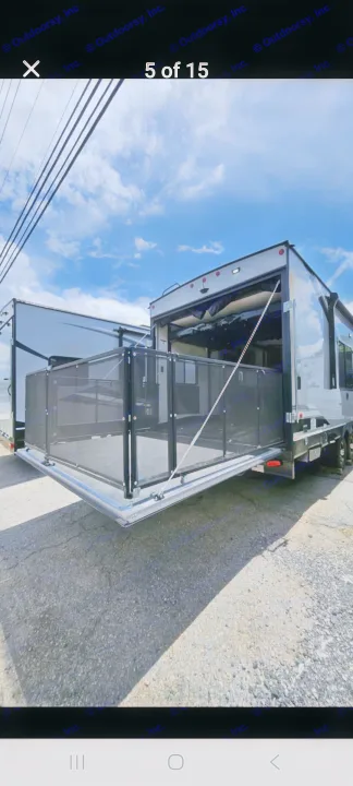 An RV rental toy hauler with its rear ramp converted into a spacious, screened patio deck, ready for outdoor adventure.. Forest River Cherokee Wolf Pack 2021