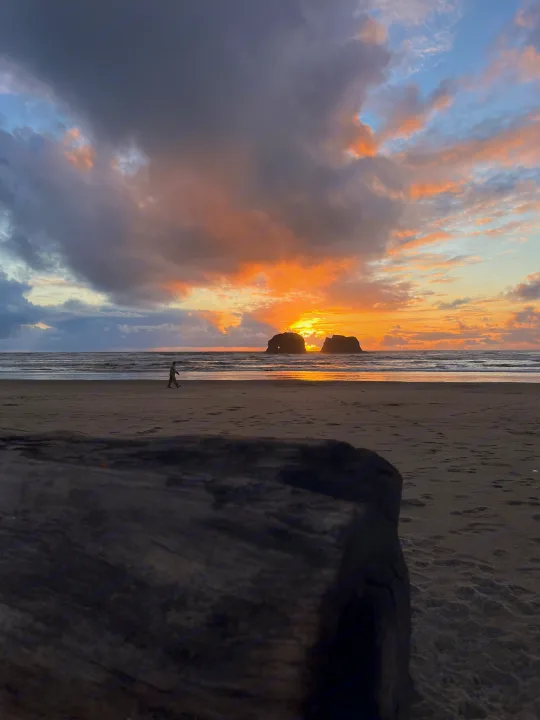 Golden sunset illuminates sea stacks on an Oregon coast beach. A peaceful walk; ideal for an RV rental adventure.. Keystone RV Springdale 2022