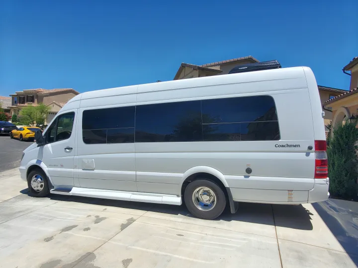White Coachmen Galleria RV rental on a sunny driveway. Ready for your next travel adventure!. Coachmen Galleria 2019