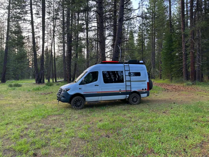 Explore nature with this rugged white Storyteller camper van, ideal for your next RV rental forest adventure.. Storyteller Overland Storyteller Overland Class B 2021