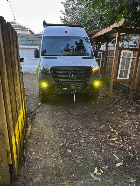 A customized Mercedes-Benz Sprinter van, equipped for adventure with off-road lights & bumper, available for rv rental.. Storyteller Overland Storyteller Overland Class B 2021