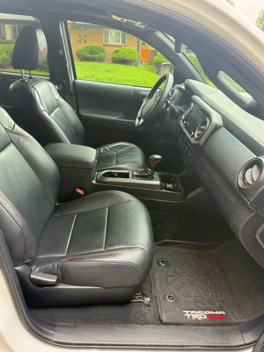Detailed Toyota Tacoma TRD Pro interior features black leather seats with red stitching & a modern dashboard. Ideal for RV rental trips.. Toyota Tacoma TRD-Pro 2020