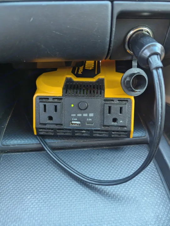 A 400W car power inverter with AC & USB ports plugged into a 12V outlet, ideal for your RV rental.. Honda Pilot 2007