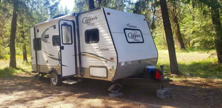 Experience nature in this Coachmen Clipper travel trailer, an ideal RV rental for forest camping adventures.. Coachmen CLIPPER 2015