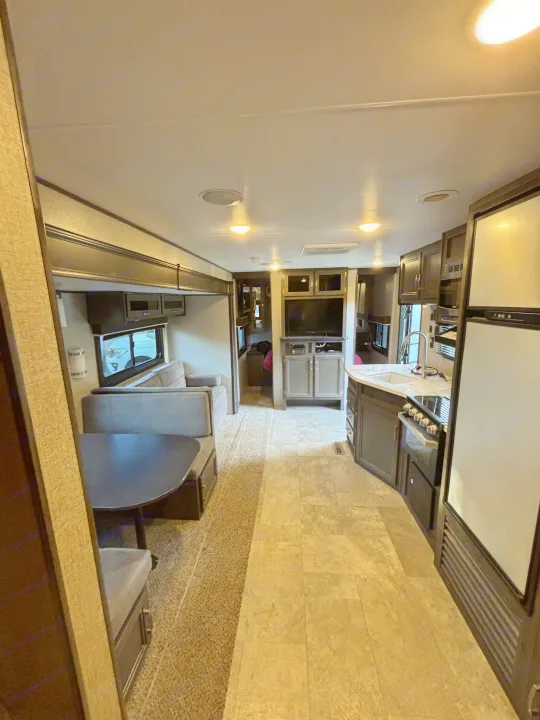 Spacious RV rental interior featuring a full kitchen, comfortable dinette, and entertainment area.. Jayco Jay Flight SLX Rocky Mountain Edition 2020