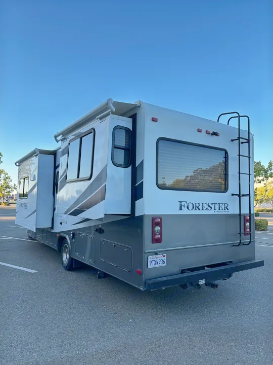 RV rental: A white and grey Forester Class C motorhome with slide-out extended, parked on asphalt.. Forest River Forester 2861DS 2016