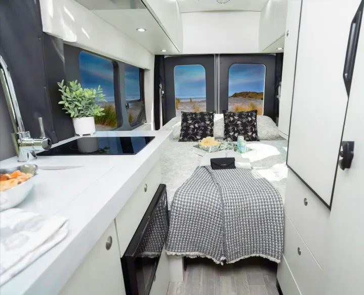 This rv rental offers a bright, modern interior with a comfy bed, functional kitchen, and scenic views.. Pleasure-Way Pleasure-Way Class B 2023