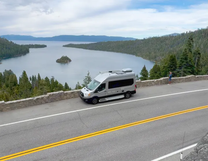 An RV rental at a stunning Lake Tahoe overlook, showcasing Emerald Bay, Fannette Island, & surrounding forests.. Pleasure-Way Pleasure-Way Class B 2023