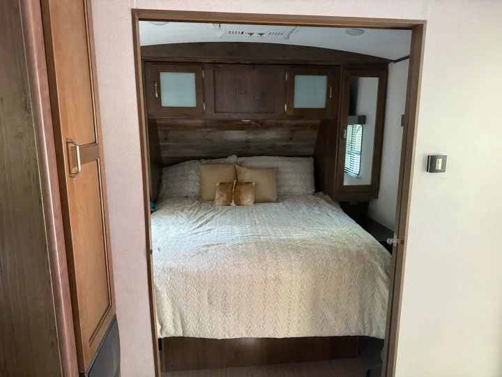 RV rental bedroom features a plush. Keystone RV Passport Grand Touring 2020