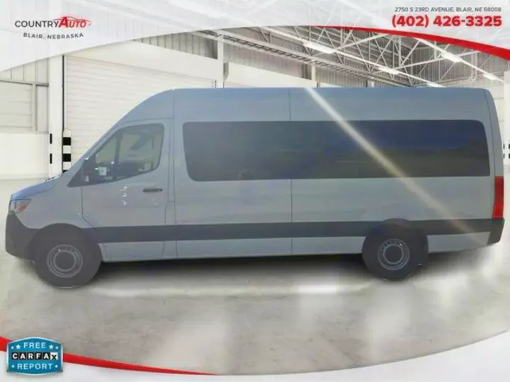 A light grey passenger van, perfect for RV rental or transport, shown at Country Auto, Blair, NE. Free Carfax available.. Mercedes Sprinter Van High Roof 2025