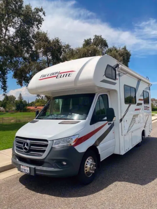 White Mercedes-Benz Sprinter Class C RV (Freedom Elite) for rv rental. Ready for camping & road trips.. Thor Freedom Elite 2020