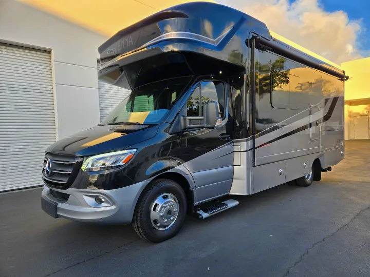RV rental: A premium black and silver Mercedes-Benz Vienna motorhome, seen parked outdoors. It features a. Renegade Custom Coaches Vienna 2021