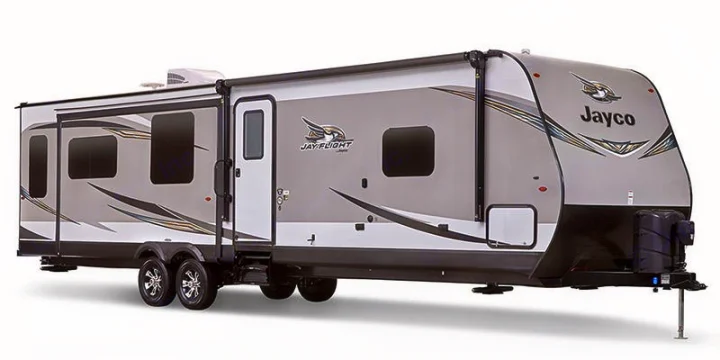 This spacious, gray & white Jayco travel trailer is ideal for RV rental. A modern recreational vehicle with many windows.. Jayco Jay Flight 2019