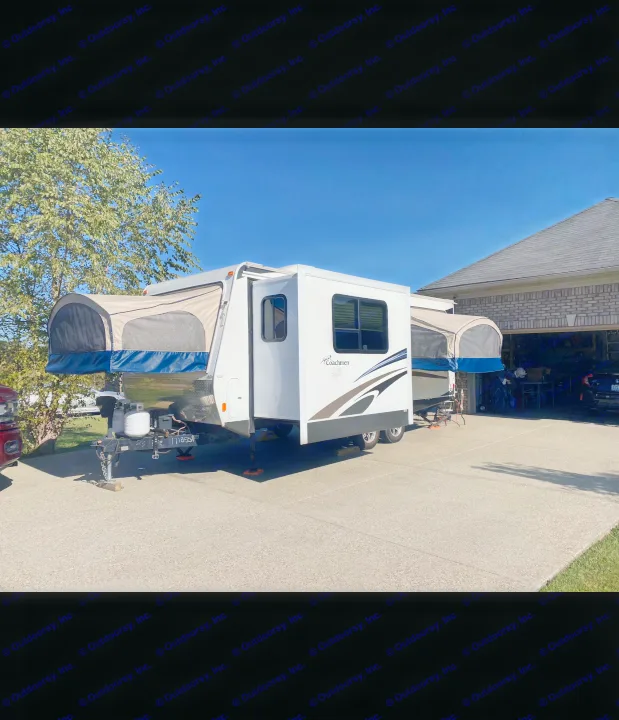 Pop-up style hybrid RV rental with extended bunks and slide-out parked on a sunny driveway.. Coachmen Freedom express ltz 2014