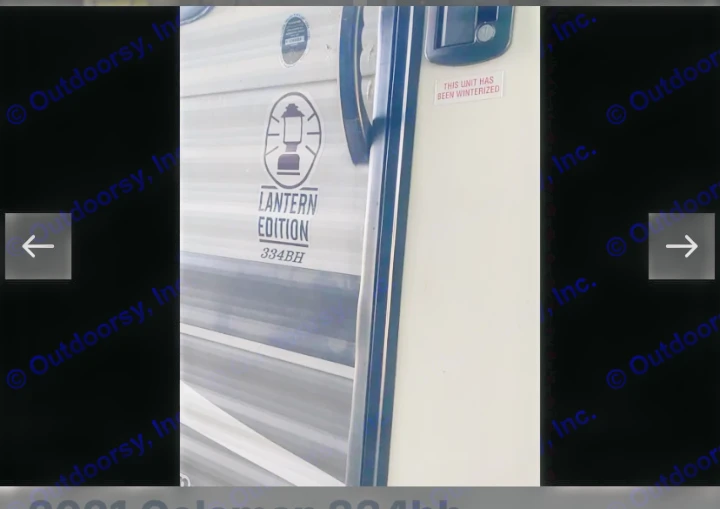 Lantern Edition 334BH travel trailer for rv rental, showing a "THIS UNIT HAS BEEN WINTERIZED" sticker on its door.. Coachmen Lantern 2021
