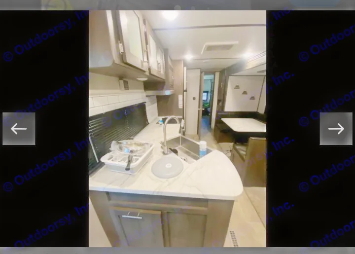 This RV rental features a bright, modern kitchen with a sink, ample counter space, and a cozy dining area.. Coachmen Lantern 2021