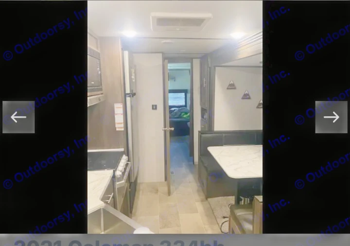 Modern RV rental interior with full kitchen, dinette booth, and rear bedroom access, perfect for your road trip comfort.. Coachmen Lantern 2021