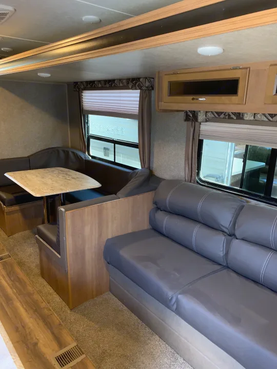 This inviting RV rental offers a comfortable dinette, sofa, and living area, ready for your next adventure.. Coachmen Other 2018