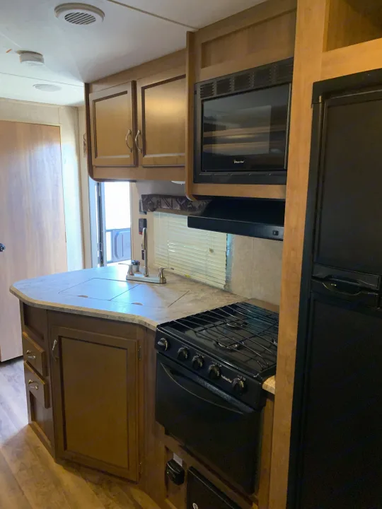 Enjoy a fully equipped RV rental kitchen! Features a stove, microwave, fridge, sink, and ample storage for your travels.. Coachmen Other 2018