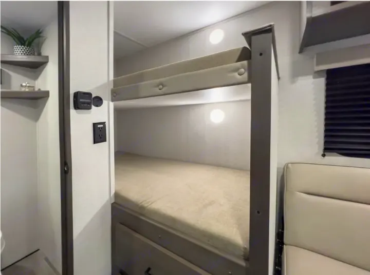 Cozy RV bunk beds with individual lighting, an outlet, and climate control, perfect for your next rv rental adventure.. Grand Design Transcend One 151BH 2025