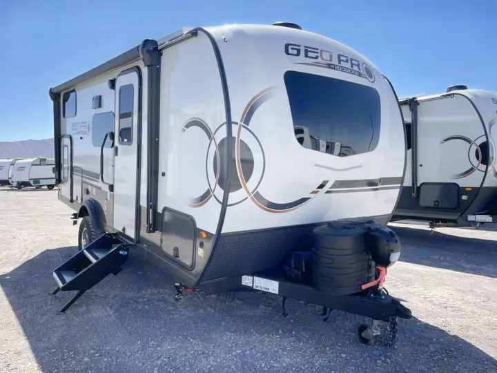 Ready for adventure! This white Geo Pro travel trailer is an ideal rv rental, parked under a clear sky.. Forest River RV Rockwood GEO Pro 2025