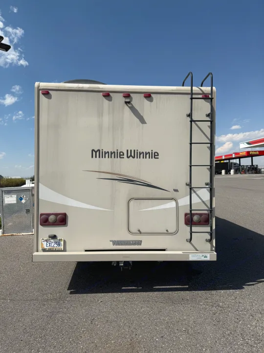 Rear view of a dirty Winnebago "Minnie Winnie" RV, possibly an rv rental, at a Pilot Travel Center.. Winnebago Minnie Winnie 2016