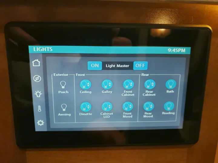 This RV rental smart panel controls interior & exterior lights (Ceiling, Bath, Mood, Awning) via its touchscreen. Time: 9:45 PM.. Coachmen Galleria 2019