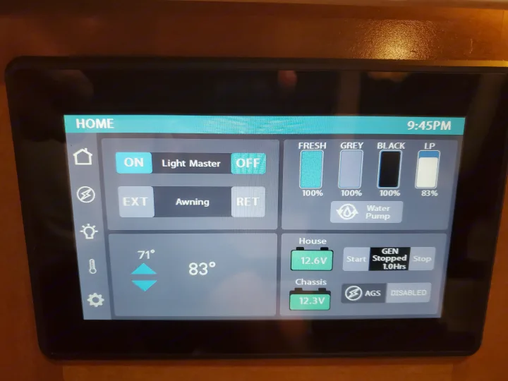 RV rental smart panel: 9:45 PM. Displays fresh/grey/black tanks 100%, LP 83%, 12.6V house battery, gen info.. Coachmen Galleria 2019