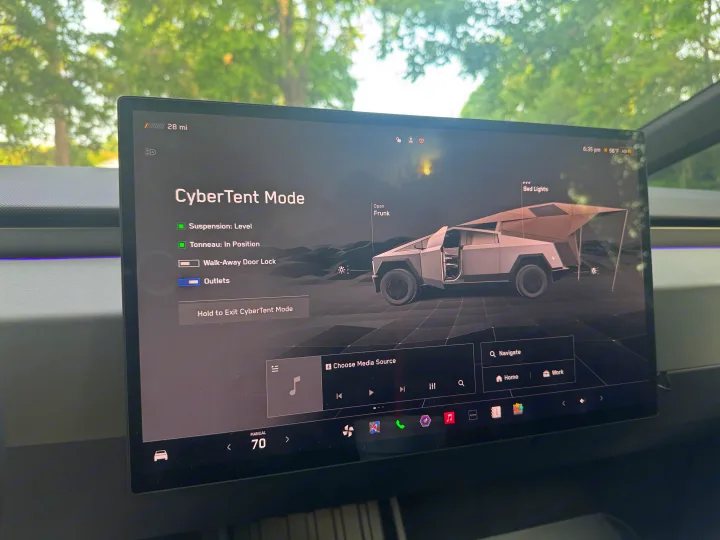 Tesla Cybertruck's CyberTent Mode UI shows its integrated tent, leveling, and power outlets; ideal for an rv rental or camping adventure.. Tesla Cybertruck 2025