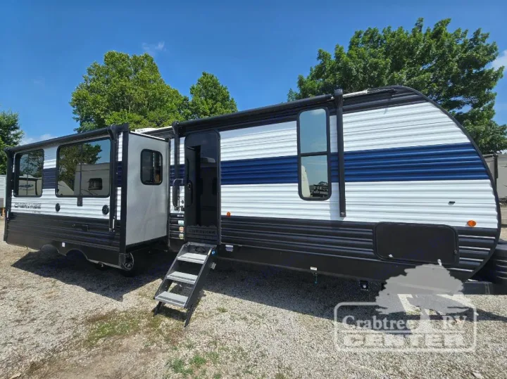Cherokee travel trailer, white & blue exterior, steps extended for an rv rental experience on a sunny day.. Forest River Cherokee M-274WK 2024