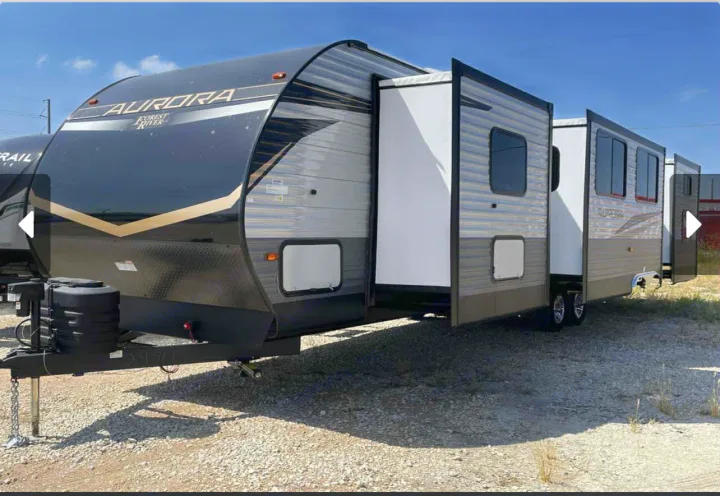 Explore in this modern Forest River Aurora travel trailer, a spacious RV rental with extended slide-outs. Perfect for camping.. Forest River Aurora Aurora 2024
