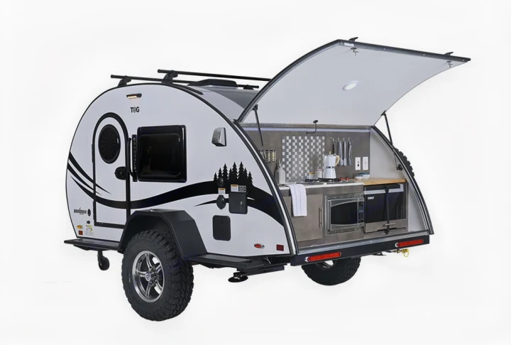 Explore the outdoors with this teardrop trailer RV rental, featuring an open rear kitchenette, off-road wheels, and roof rack.. nuCamp T@G 2023