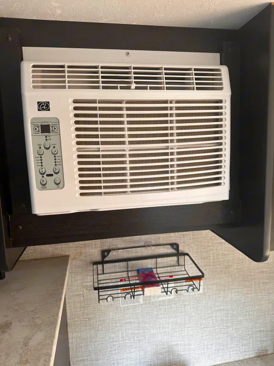 This rv rental features a built-in air conditioner unit under a cabinet, providing comfort on the go.. Braxton Creek Bushwhacker Plus 2022