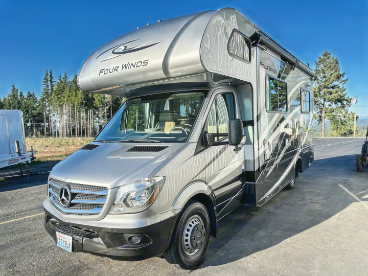 Silver Mercedes-Benz Four Winds RV rental, a Class C motorhome ready for adventure.. Thor Four Winds 2019