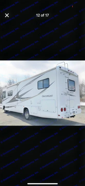 Explore in style with this white Georgetown Class A RV rental. A large recreational vehicle featuring sleek side graphics & a ladder.. Forest River Georgetown 320 DS 2011
