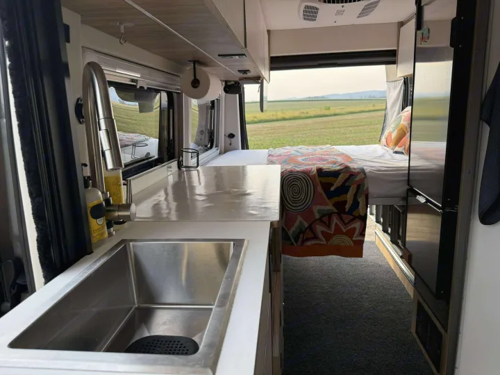 This rv rental features a modern kitchen, comfy bed, and views of nature for your ultimate travel adventure.. Coachmen PIXEL 2026
