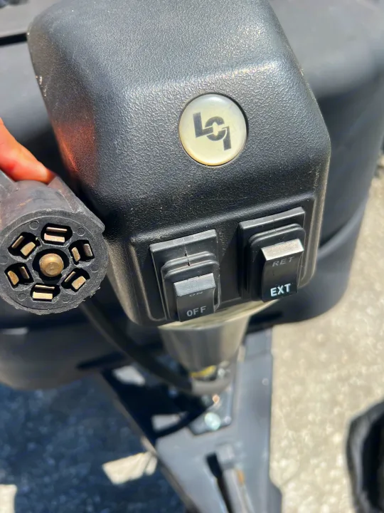 This RV rental's powered tongue jack features a 7-pin connector, 'OFF/ON' switch, and 'RET/EXT' controls for easy setup.. Coachmen FREEDOM EXPRESS 2021