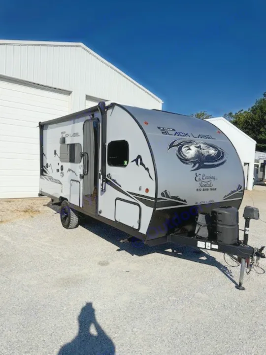 This sleek gray Black Label travel trailer RV rental from E. Leaning Rentals is ready for adventure!. Cherokee WOLF PUP  16BHSBL 2023