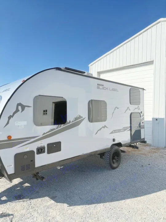 Explore with this modern grey RV rental. This sleek travel trailer with mountain graphics is ready for adventure.. Cherokee WOLF PUP  16BHSBL 2023