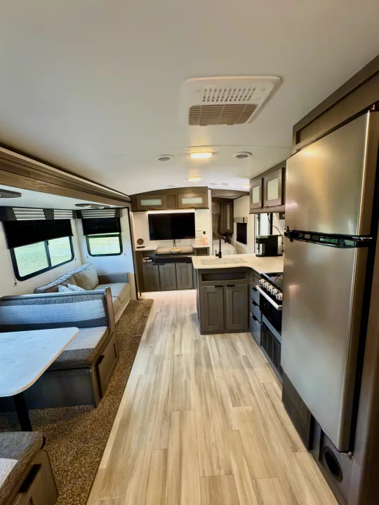 Explore this bright, modern RV rental interior featuring a full kitchen, comfortable living area, and ample space.. Cruiser RV MPG Ultra Lite 2022