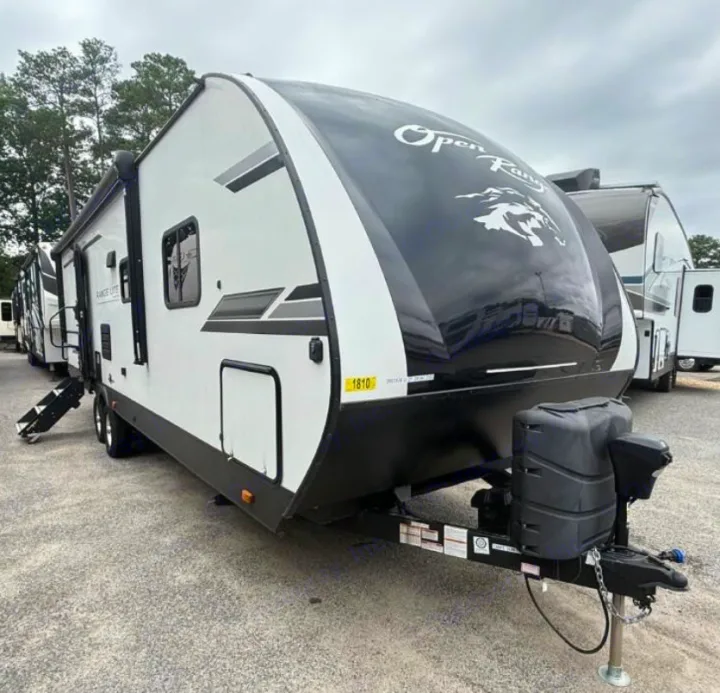 Black and white Open Range travel trailer for your next RV rental adventure. Ready for the road!. Highland Ridge RV Range Lite 2021