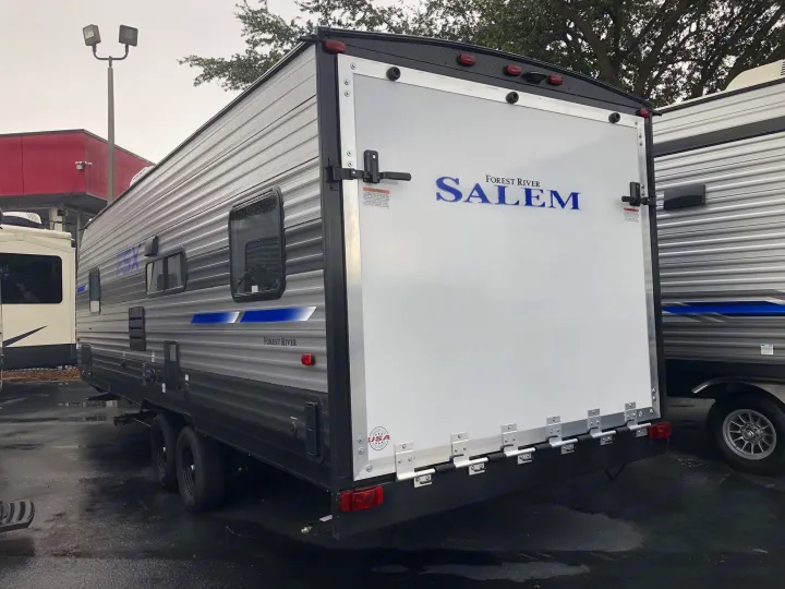 This gray Forest River Salem travel trailer, with a large rear ramp door, awaits your next rv rental adventure.. Forest River Salem 2021