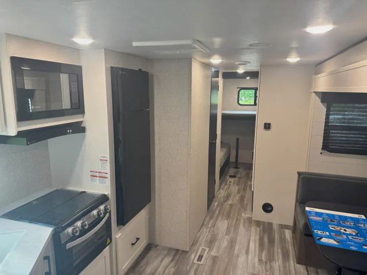 Inside this clean **rv rental**, you'll find a full kitchen, central refrigerator, inviting dinette, and cozy bunk beds.. Jayco Jay Jay Flight 294QBS 2025