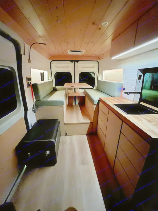 Discover this cozy RV rental's camper van interior, featuring a dinette, kitchen, & ambient lighting.. Dodge Ram 1500 2021