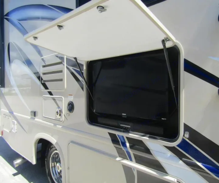 This RV rental features an exterior TV and soundbar setup, ideal for outdoor entertainment on your motorhome adventure.. Thor Chateau 2019