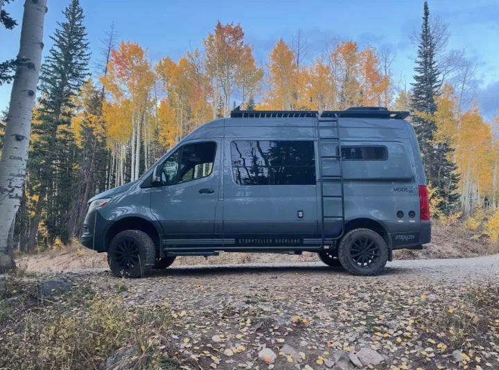 Adventure-ready grey Storyteller Overland RV rental amidst golden fall aspens in a scenic forest.. Storyteller Overland Storyteller Overland Class B 2021