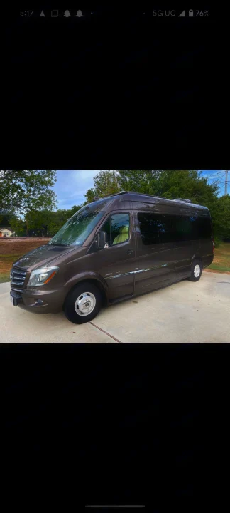 Dark brown Mercedes-Benz Sprinter van, ideal for RV rental adventures, parked on concrete.. Roadtrek Roadtrek Class B 2016