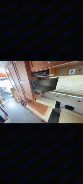 Inside this RV rental: a well-appointed living space with a cozy dinette, wall-mounted TV, and entertainment console.. Roadtrek Roadtrek Class B 2016